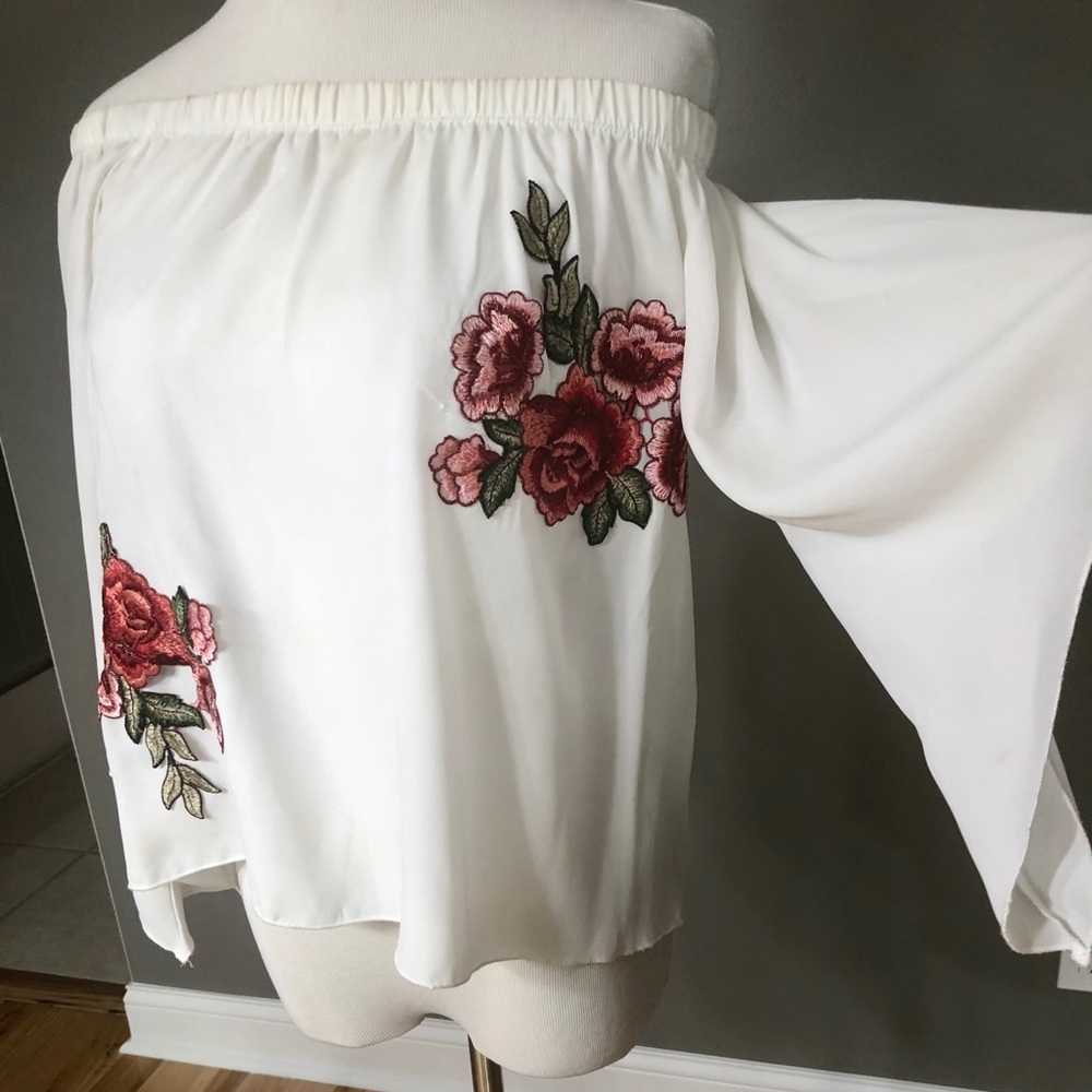 Off shoulder, open back top with flower appliqués